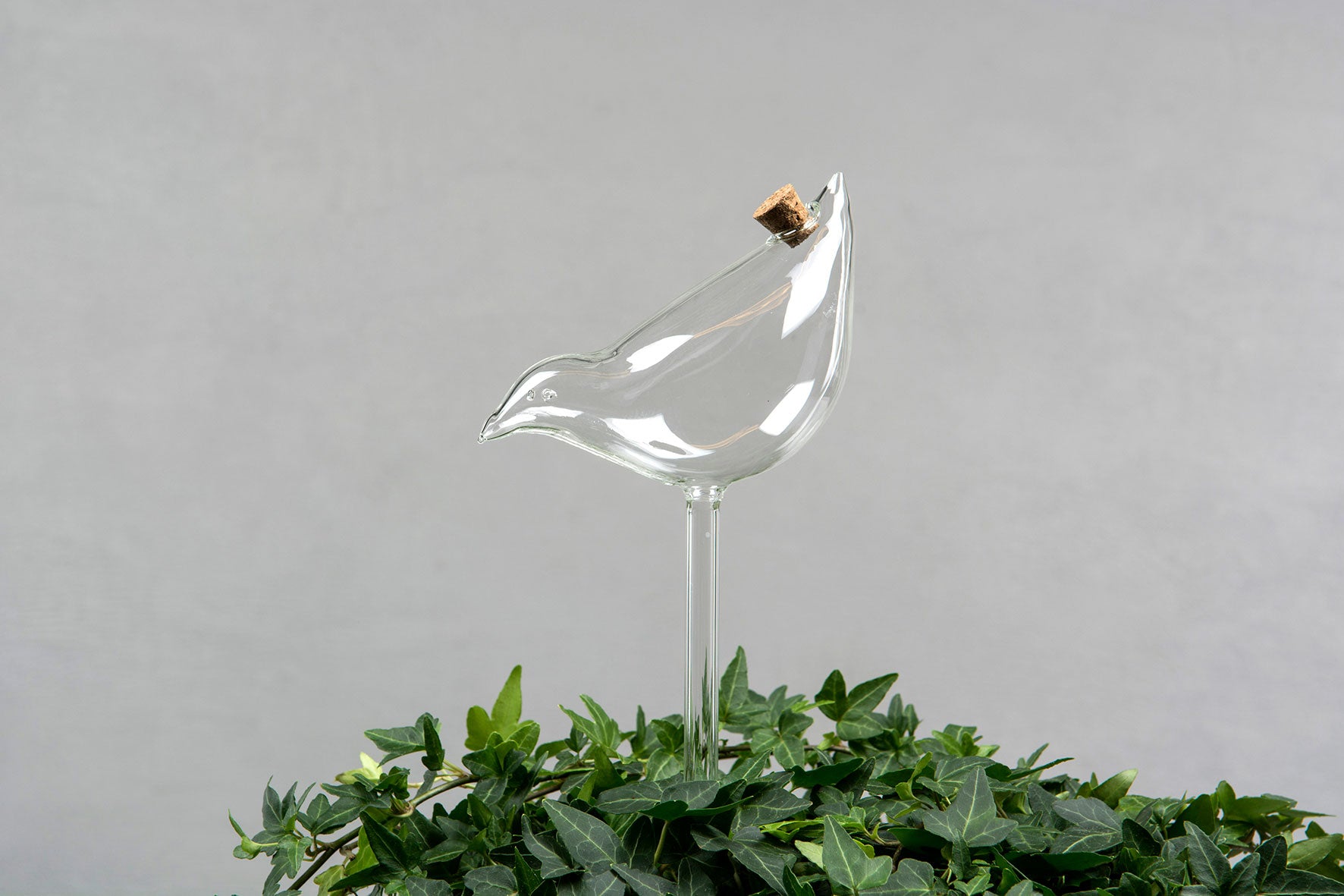 Vanningsglass formet som fugl – selvvanning til planter